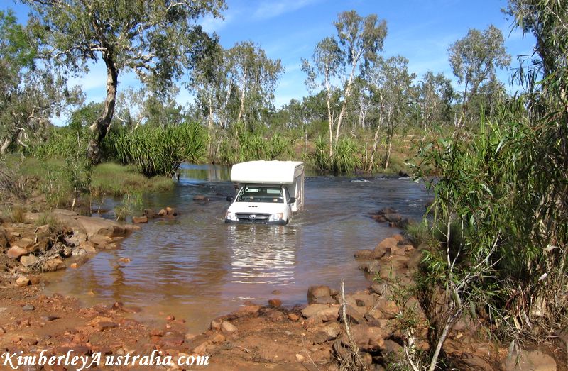 Hired campervan crosses a river