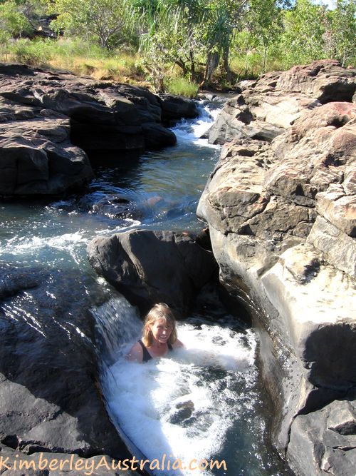Sitting in a natural spa pool on the Mitchell Plateau