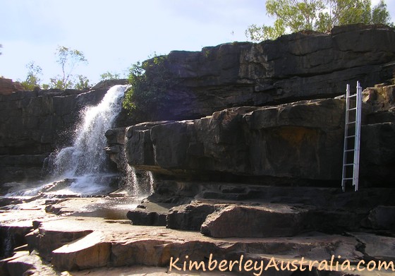 The ladder takes you down to the pool and waterfall