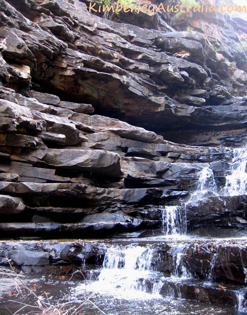 The rock wall that connects the first and second pool.