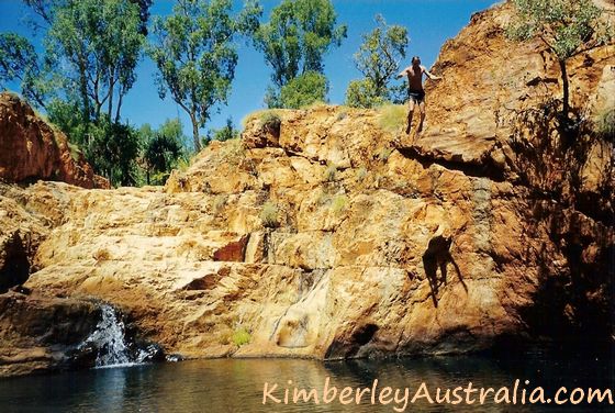 Guy jumping into one of the pools at Harry's Hole